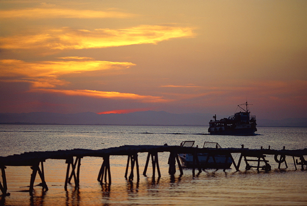 Jetty and ferry at sunset at Moyogalpa in the west of Omotepe Island, Lake Nicaragua, Nicaragua, Central America