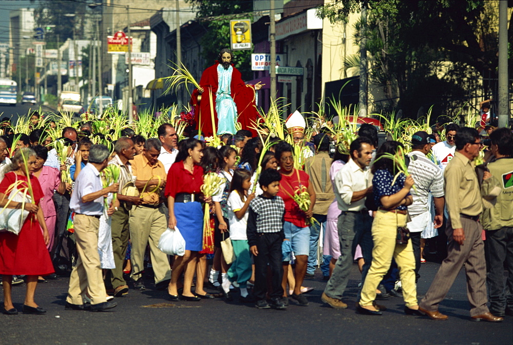 Crowds of people in the Palm Sunday procession in the centre of San Salvador, El Salvador, Central America