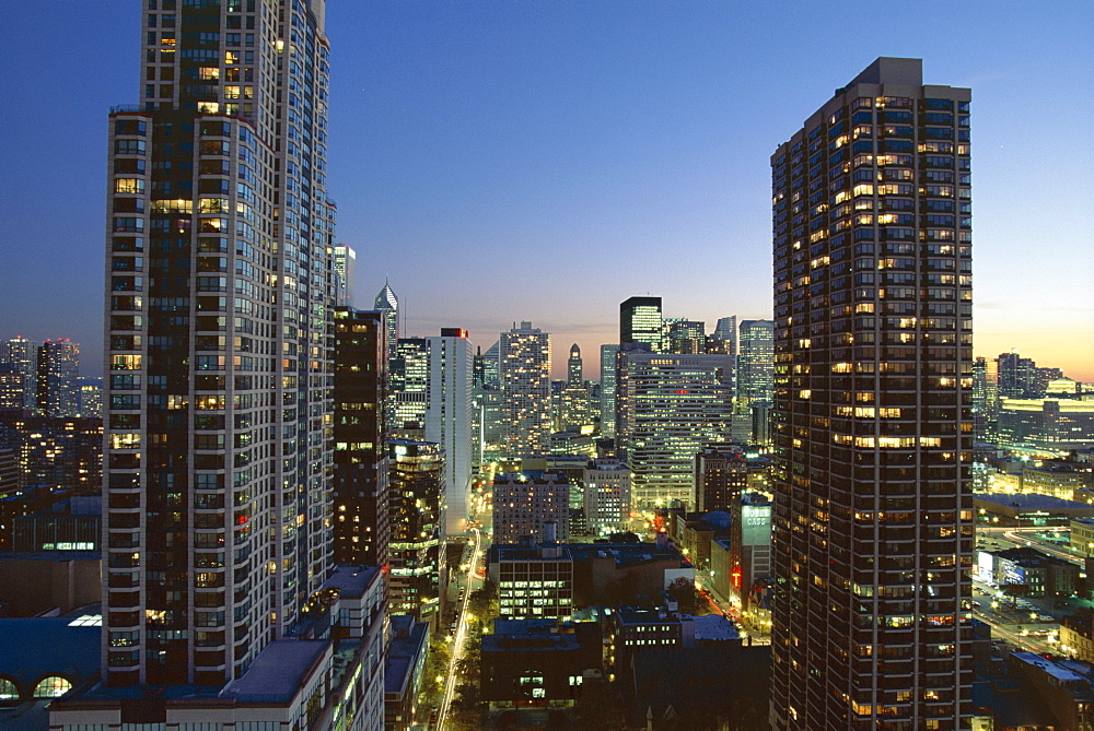 Looking south down Rush and Wabash Street in the evening, Chicago Place on the left, Near North of downtown area, Chicago, Illinois, United States of America (USA), North America