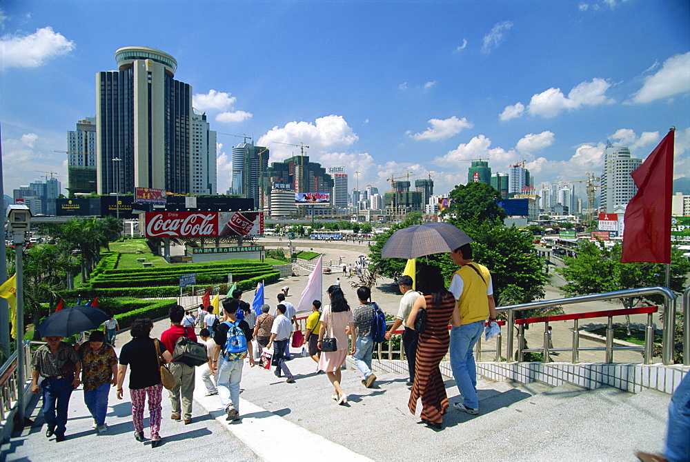 Street scene of pedestrian walkway in the centre of Shenzhen City in the Special Economic Zone boomtown on border with Hong Kong, China, Asia