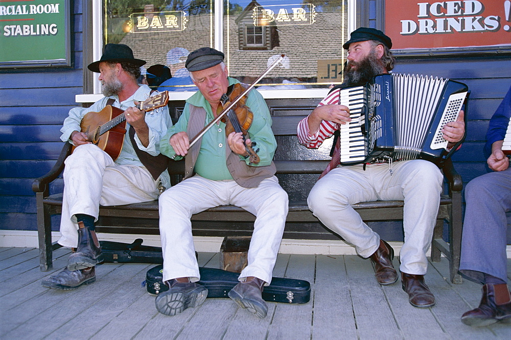 Group playing at Sovereign Hill, re-creation of an 1860s gold-mining township near Ballarat, west of Melbourne, Victoria, Australia, Pacific