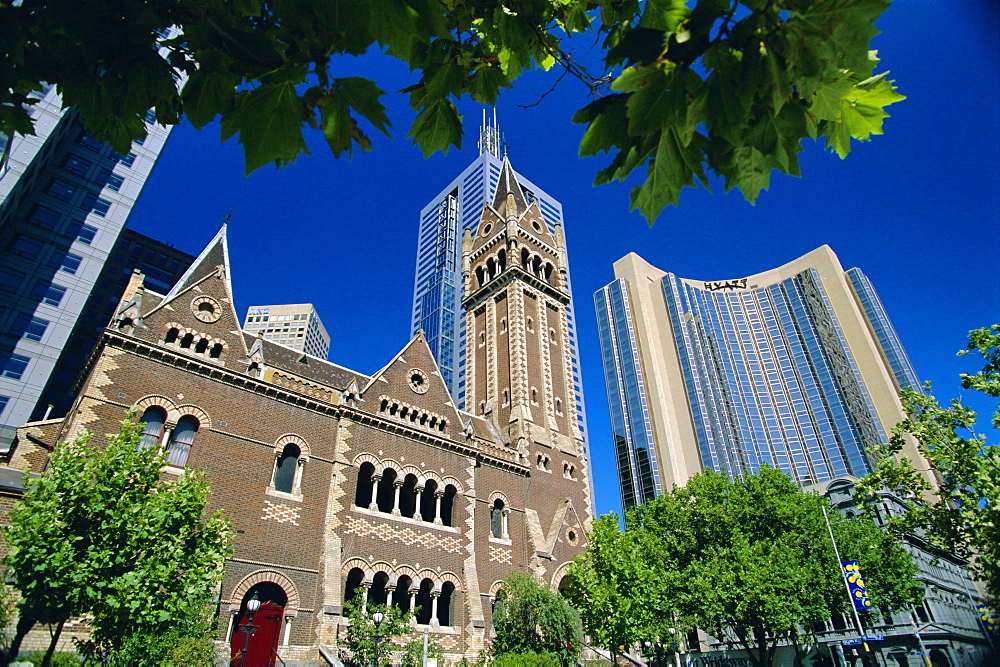 Hyatt Hotel, other tower blocks and older church at the junction of Russell and Collins Streets in the city centre, Melbourne, Victoria, Australia