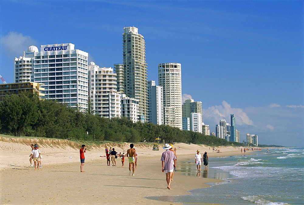 Morning walkers on the beach at the resort of Surfers Paradise on the Gold Coast of Queensland, Australia, Pacific