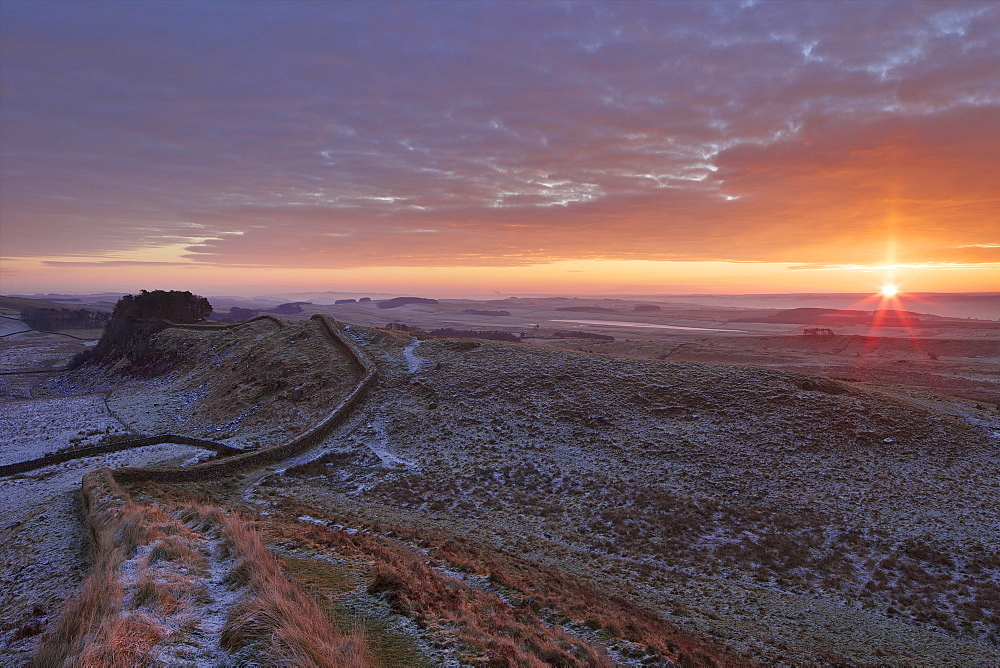 Sunrise and Hadrian's Wall National Trail in winter, looking to Housesteads Fort, Hadrian's Wall, UNESCO World Heritage Site, Northumberland, England, United Kingdom, Europe 