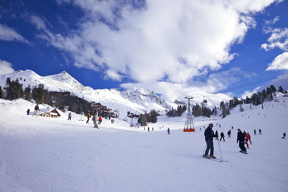 Skiers on piste at Belle Plagne, La Plagne, Savoie, French Alps, France, Europe 