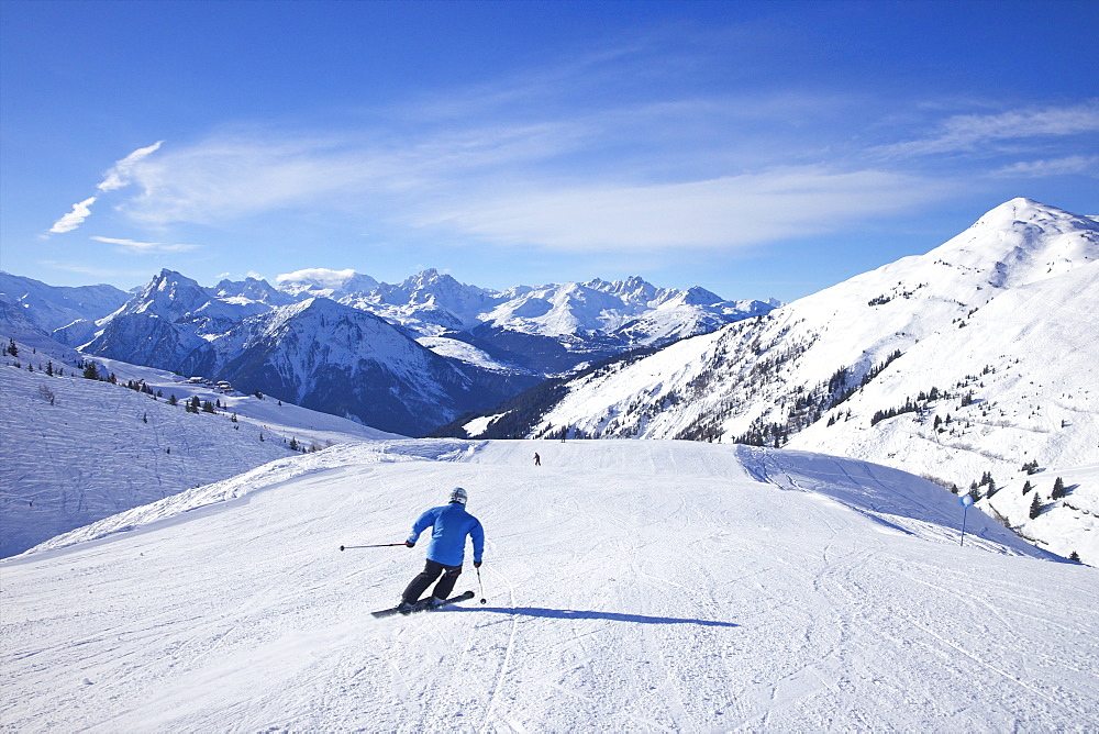 Skiers on Levasset blue piste in winter sunshine, Champagny, La Plagne, French Alps, France, Europe 