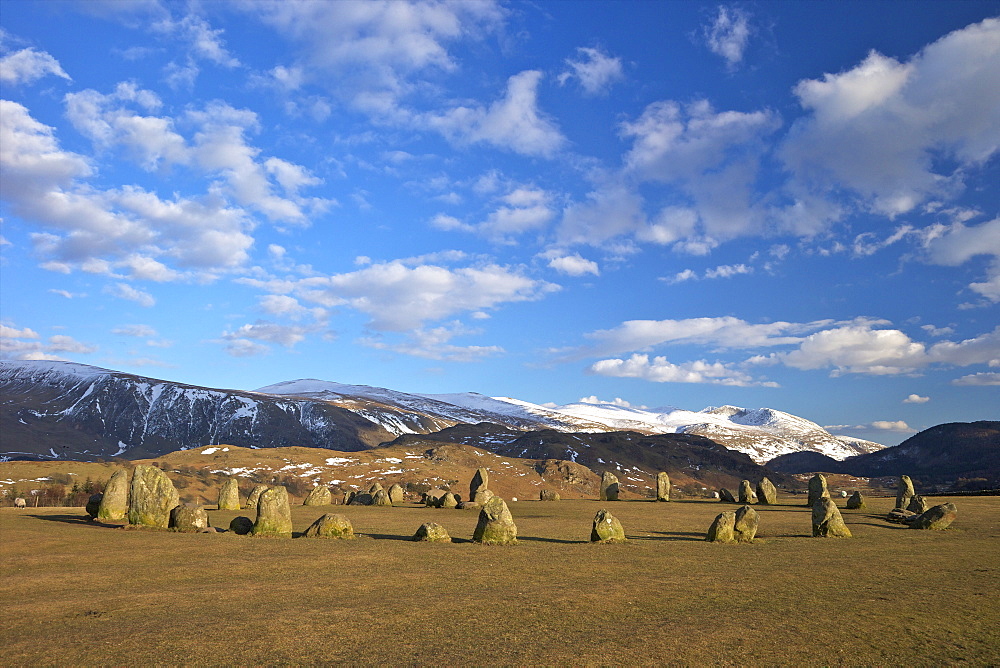 Castelrigg Megalithic Stone Circle in winter with Helvellyn range behind, Lake District National Park, Cumbria, England, United Kingdom, Europe 