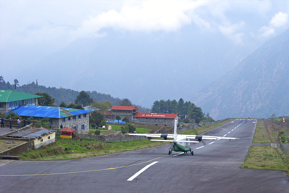 Tara Air DHC-6 Twin Otter plane taking off from runway, Tenzing-Hillary Airport, Lukla, Nepal, Asia