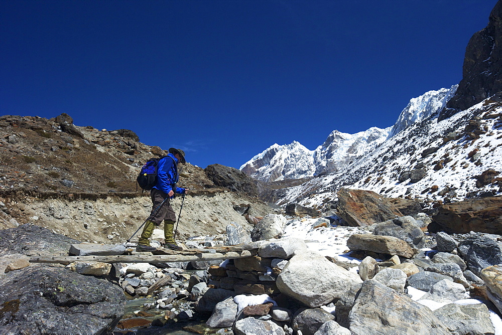 Trekker crossing the Chola Khola valley near Dzonglha, Solukhumbu District, Sagarmatha National Park, UNESCO World Heritage Site, Nepal, Himalayas, Asia 