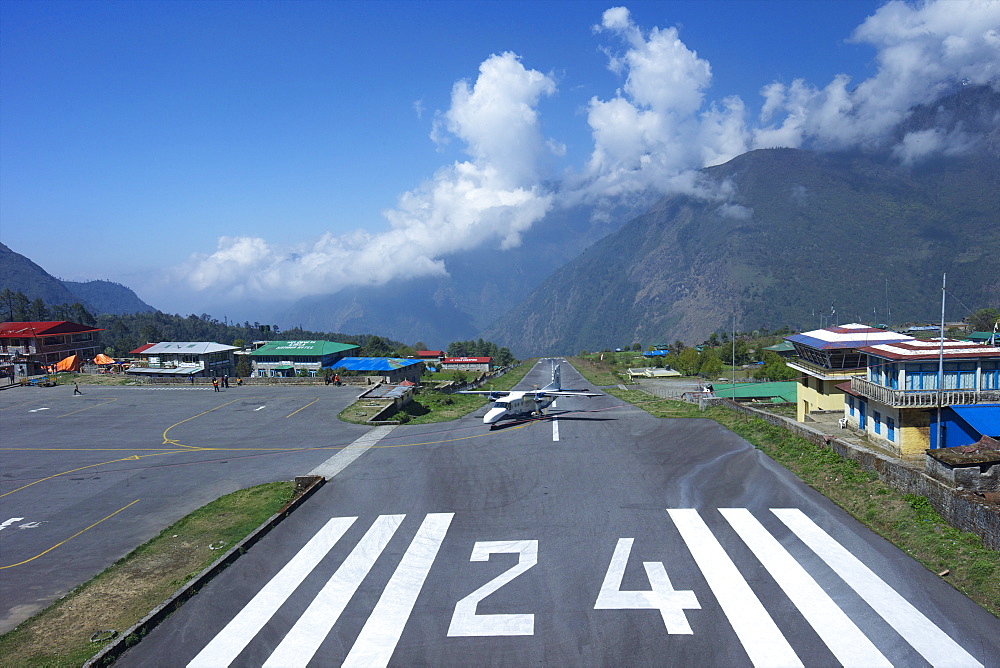 Sita Air Dornier 228 airplane landing on runway, Tenzing-Hillary Airport, Lukla, Nepal, Asia