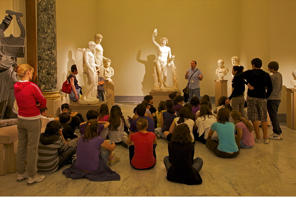 Schoolchildren learning about Roman sculpture at the National Archaeological Museum in Naples, Campania, Italy, Europe