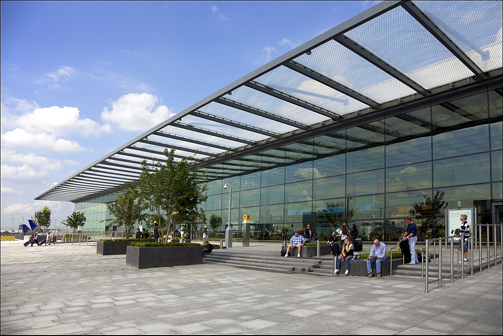 Passengers wait outside Terminal 4, Heathrow Airport, London, England, United Kingdom, Europe