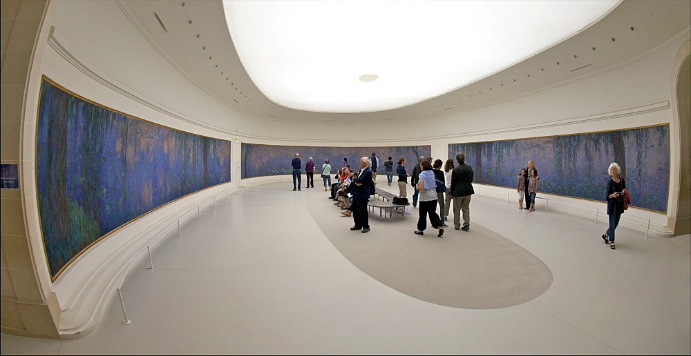 Visitors and tourists admire the Water-lilies by Claude Monet, Musee de L'Orangerie Museum, Paris, France, Europe