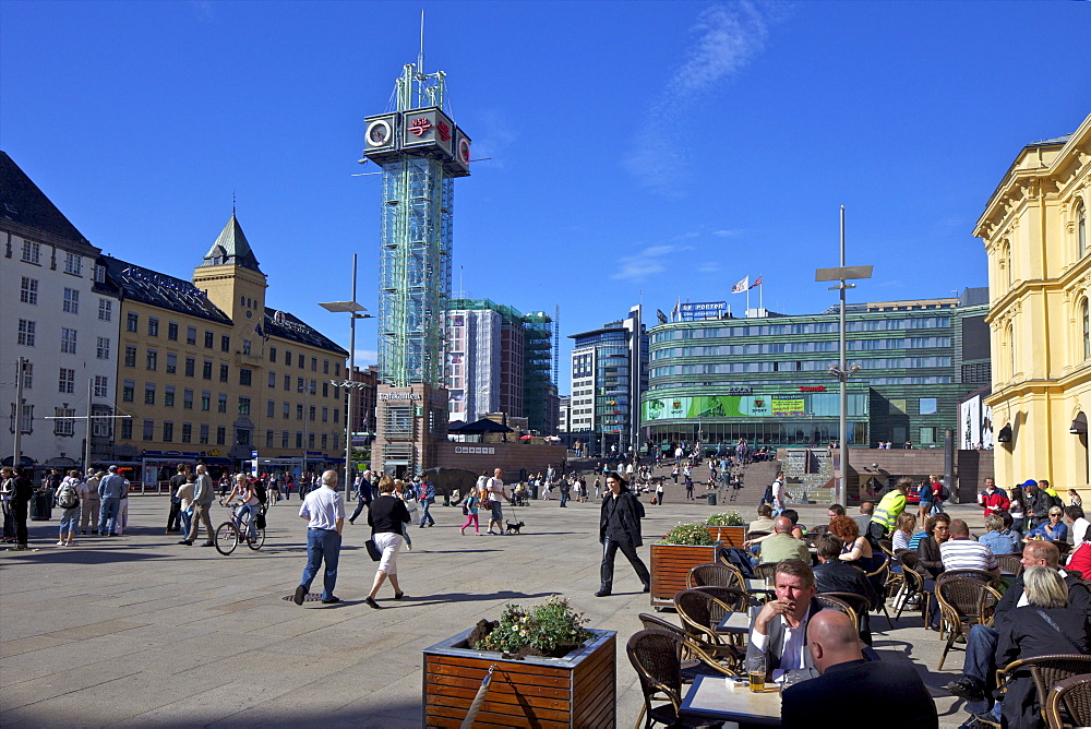 Tourists and visitors drinking outside in cafes and bars in summer sunshine, Christian Frederiks Plass, city centre, Oslo, Norway, Scandinavia, Europe