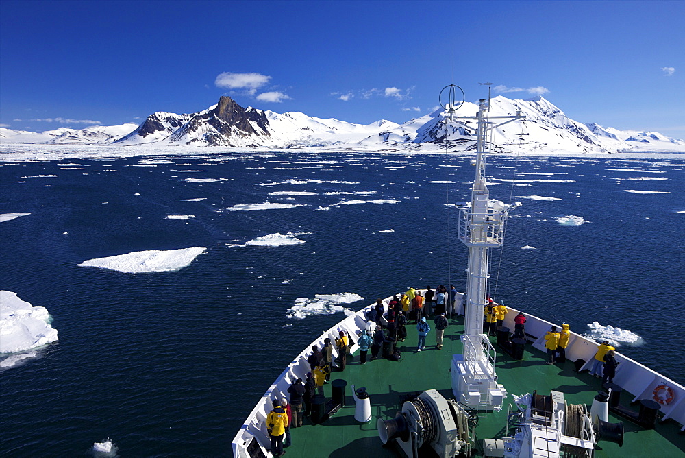 Expedition cruise vessel in  Hornesund Fjord in summer sunshine, Spitzbergen, Svalbard, Arctic Norway, Scandinavia, Europe