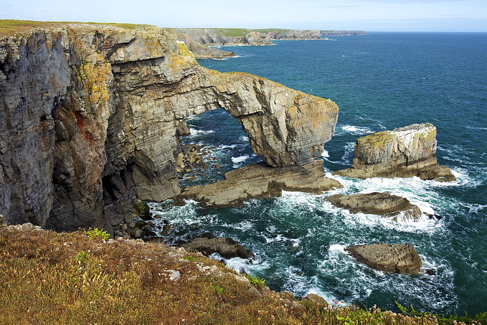 Green Bridge of Wales, natural rock arch, spring evening sunshine, Pembrokeshire Coast National Park, Wales, United Kingdom, Europe