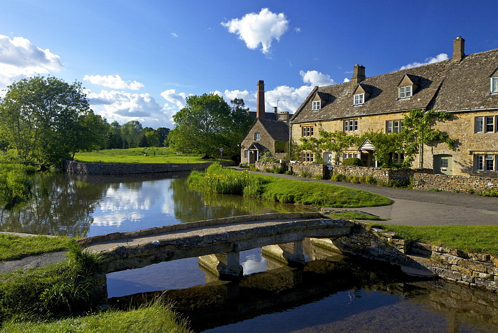 River Eye flowing through the pretty village of Lower Slaughter, the Cotswolds, Gloucestershire, England, United Kingdom, Europe