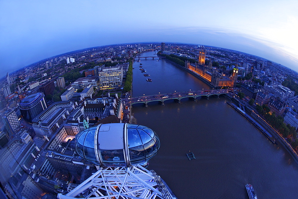 View of passenger pod capsule, Houses of Parliament, Big Ben and the River Thames from the London Eye at dusk, London, England, United Kingdom, Europe