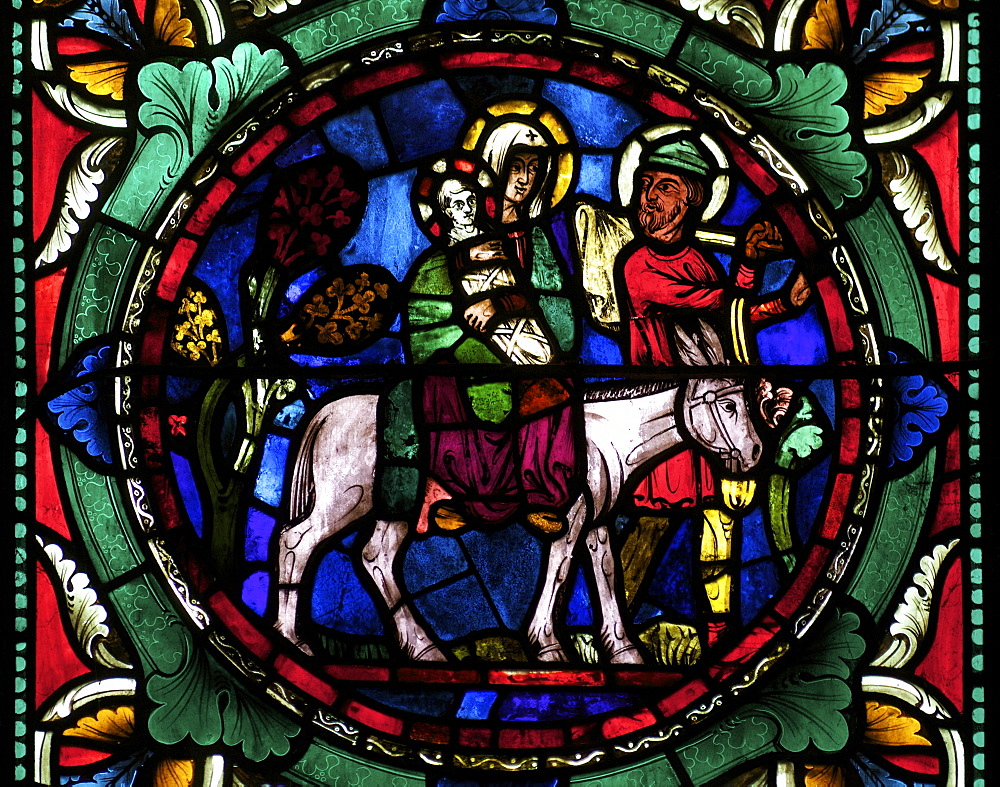 Medieval stained glass depicting Mary, baby Jesus and Joseph on a donkey, Canterbury Cathedral, UNESCO World Heritage Site, Canterbury, Kent, England, United Kingdom, Europe