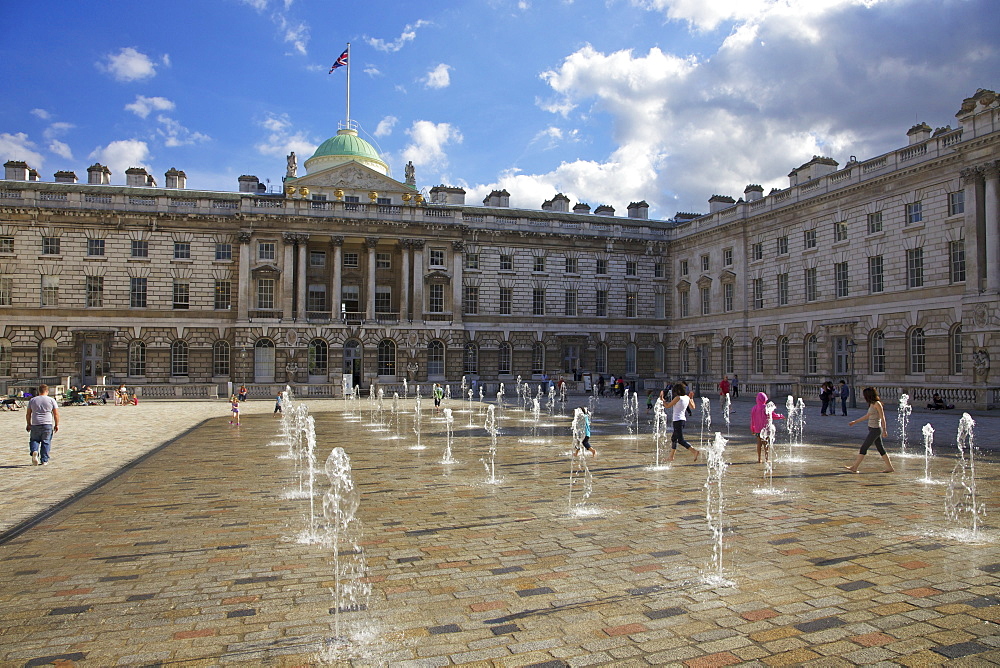 Children playing in summer sun, Edmond J. Safra Fountain Court, Somerset House, London, England, United Kingdom, Europe