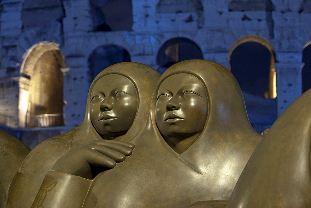 Detail of the modern bronze sculpture Pareja by Jimenez Deredia, 2009, in Piazza del Colosseo, by night, Rome, Latium, Italy, Europe