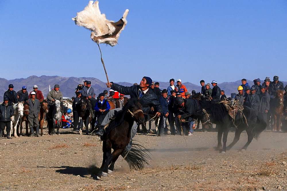 Kek Bar, game similar to the Buzkashi, Horsemen competing for a goat skin, Golden Eagle Festival, Bayan Oelgii, Altai Mountains, Mongolia, Asia