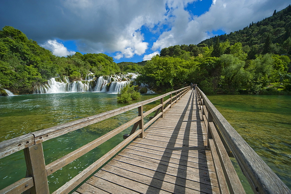 Wooden bridge and waterfalls in Krka National Park, aeibenik-Knin County, Croatia, Europe