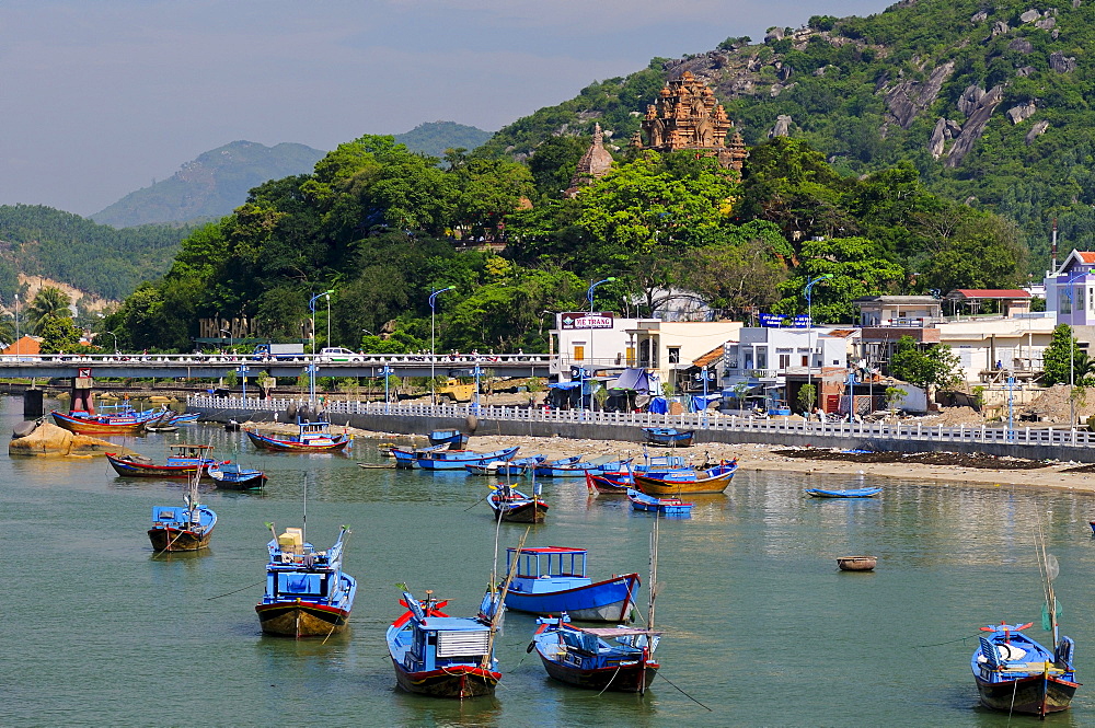 Fishing boats, Port of Nha Trang on the Cai river, in the back the Po Nagar temple, Vietnam, Southeast Asia