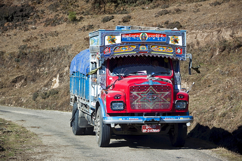 Locally decorated good carrier on the national highway, Bhutan, South Asia