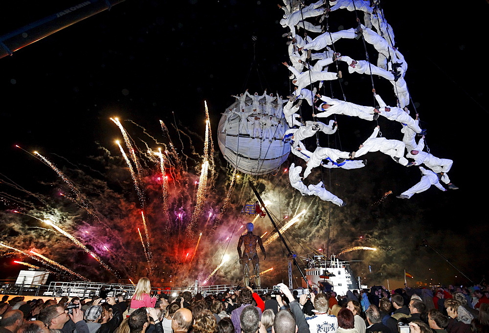 White-clad trapeze artists and globe floating in the sky, Global Rheingold, open-air theater by La Fura dels Baus, Duisburg-Ruhrort, Ruhrgebiet area, North Rhine-Westphalia, Germany, Europe