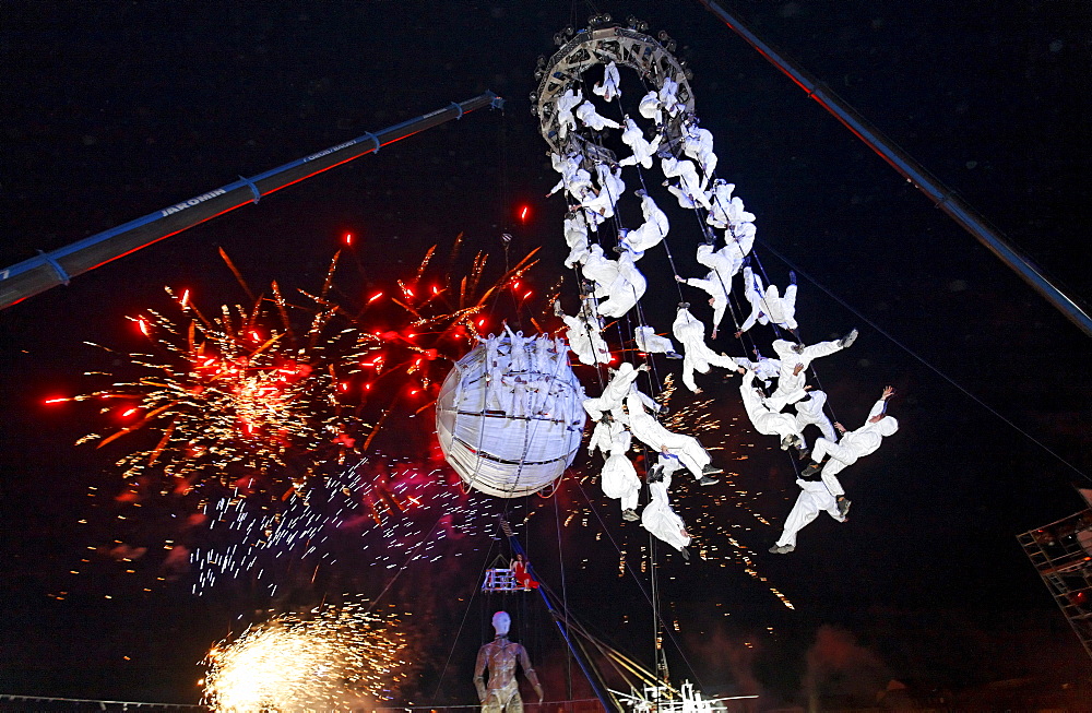 White-clad trapeze artists and globe floating in the sky, Global Rheingold, open-air theater by La Fura dels Baus, Duisburg-Ruhrort, Ruhrgebiet area, North Rhine-Westphalia, Germany, Europe