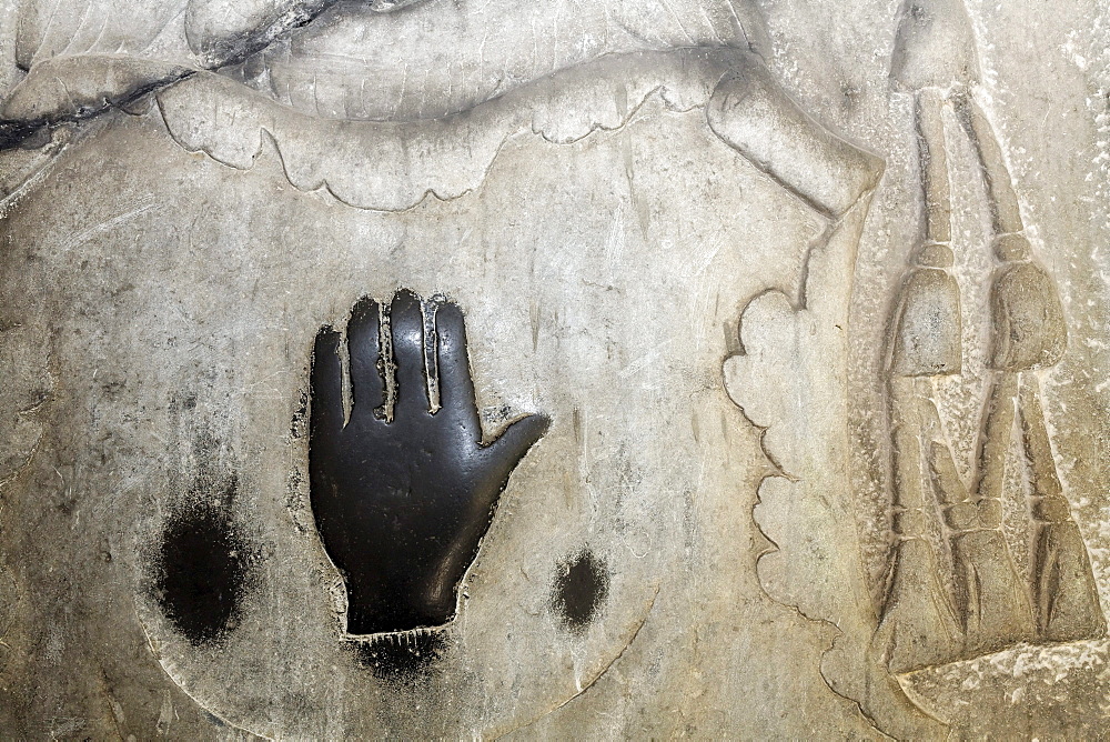 Magic black hand on a weathered grave slab in the cloister, former monastery of St. Viktor, Xanten, Lower Rhine region, North Rhine-Westphalia, Germany, Europe