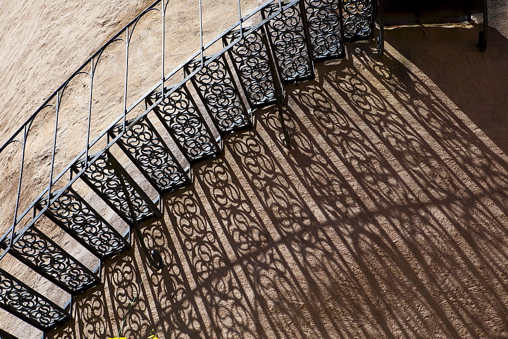 Shadow of an iron staircase at a tower