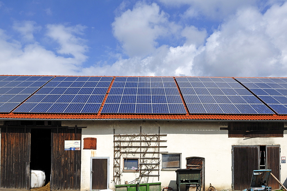 Photovoltaic system on the roof of a cowshed, Nuschelberg, Middle Franconia, Bavaria, Germany, Europe