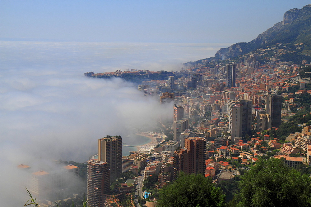 Principality of Monaco with fog over the sea, Cote d'Azur, Mediterranean Sea, Europe