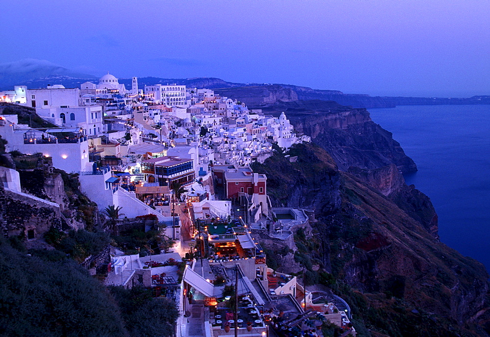 Town of Thira, Fira, on the crater rim, with typical Cycladic architecture, at dusk, Santorini, Cyclades, Greece, Europe