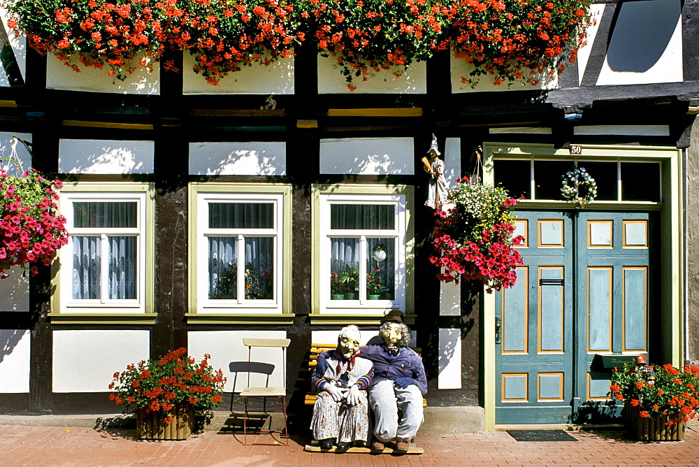 Figures in front of a half-timbered house, Stolberg, Harz, Saxony-Anhalt, Germany, Europe