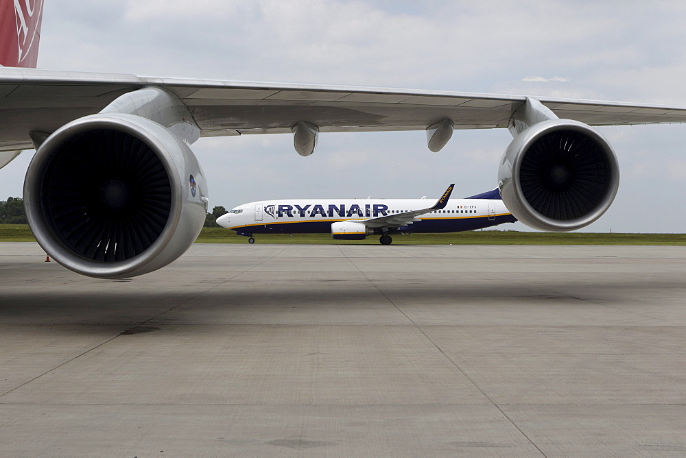 A Boeing 737_800 of the the Irish low-cost airline Ryanair passing a Boeing 747 cargo machine, Flughafen Frankfurt-Hahn airport, Lautzenhausen, Rhineland-Palatinate, Germany, Europe