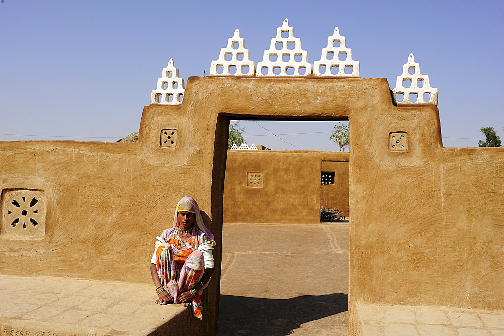 Young woman at the entrance to a courtyard, Thar Desert, Rajasthan, North India, India, Asia