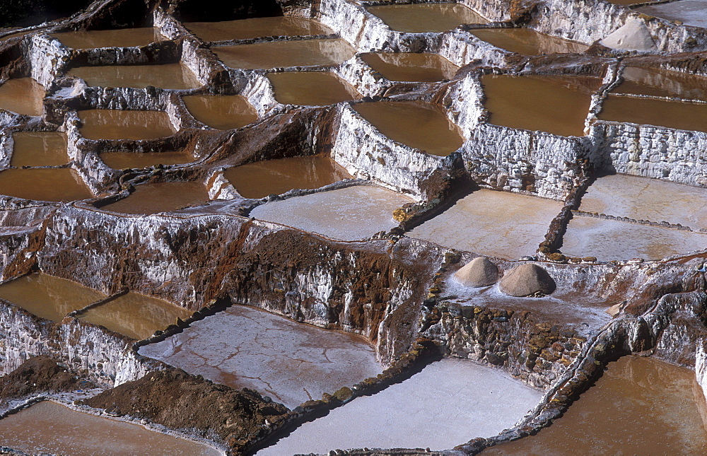 Salt production by evaporation on a mountain slope at Pichingote, the salt terraces were already in use during the time of the Incas, southern Peru, South America