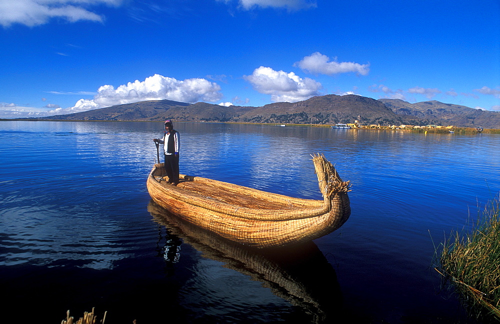 Aymara indigenous people on a reed boat made from Totora-reeds, Lake Titicaca, Peru, South America