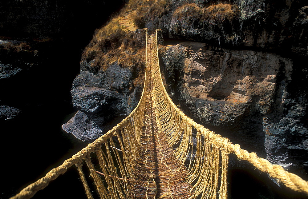 Queswachaka suspension bridge made from plant fibers, Ichu grass, over the Apurimac, Southern Peru, South America