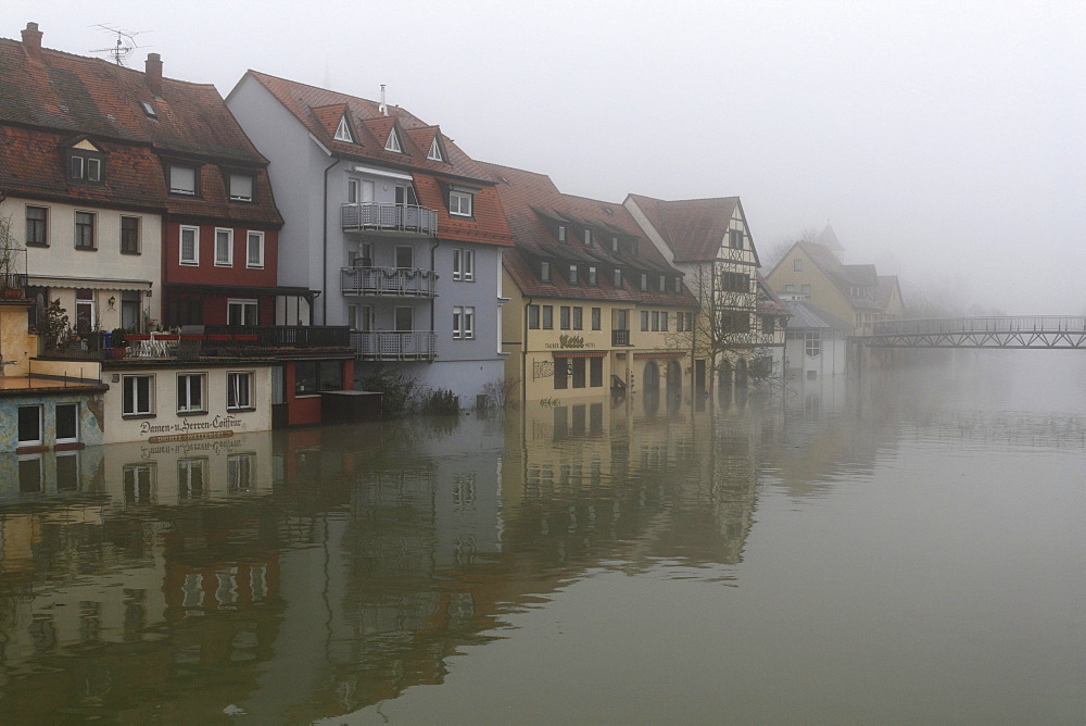 Floodwaters and fog, buildings on the bank of the Tauber river, seen from the Tauber river bridge on Bahnhofstrasse street from a southerly direction, Main estuary, Wertheim, Baden-Wuerttemberg, Germany, Europe