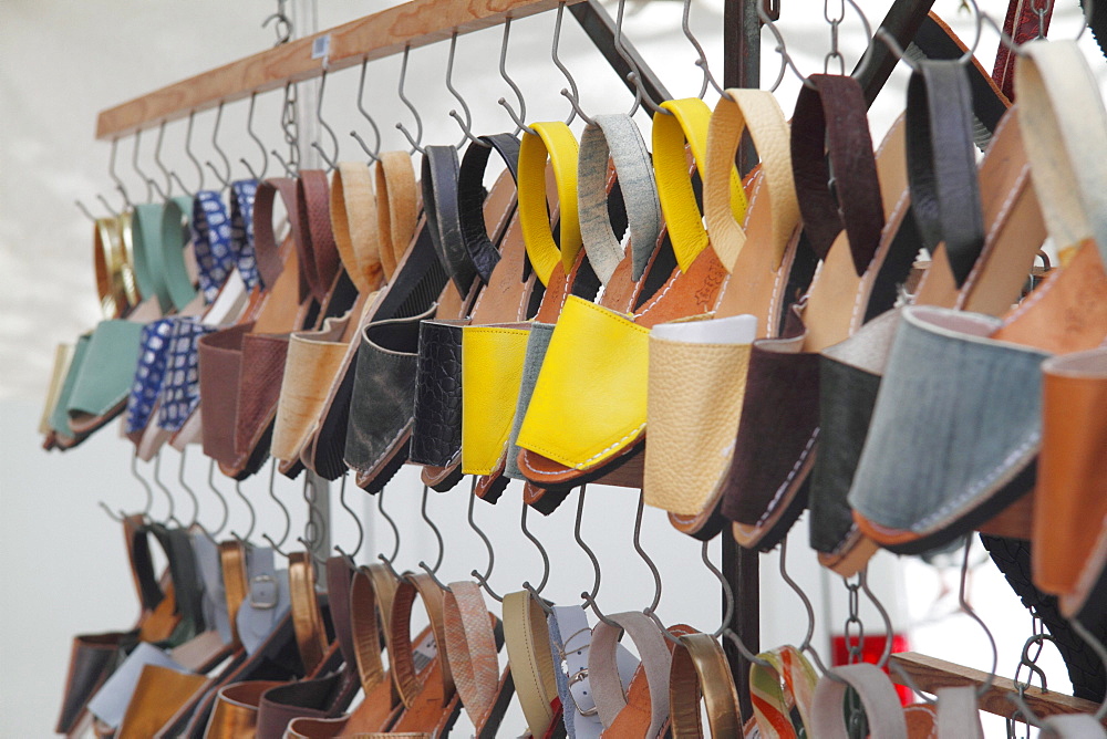 Typical Menorca sandals with soles made from car tire rubber on a weekly market at Placa des Born in Ciutadella, Menorca, Spain, Europe