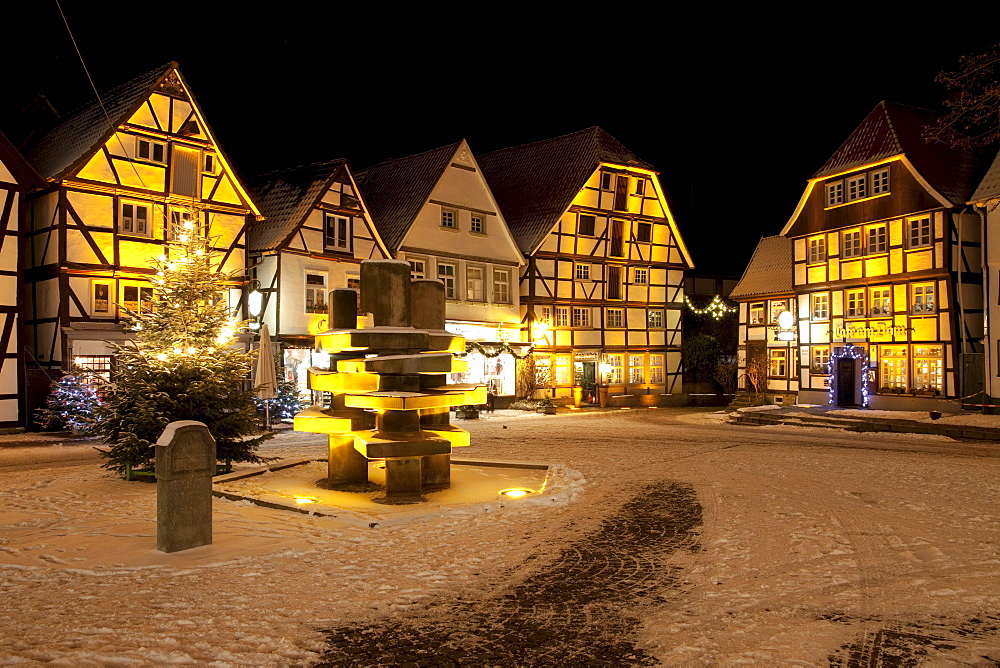 Half-timbered houses in the historic town centre with a Christmas tree and snow, Soest, Sauerland, North Rhine-Westphalia, Germany, Europe