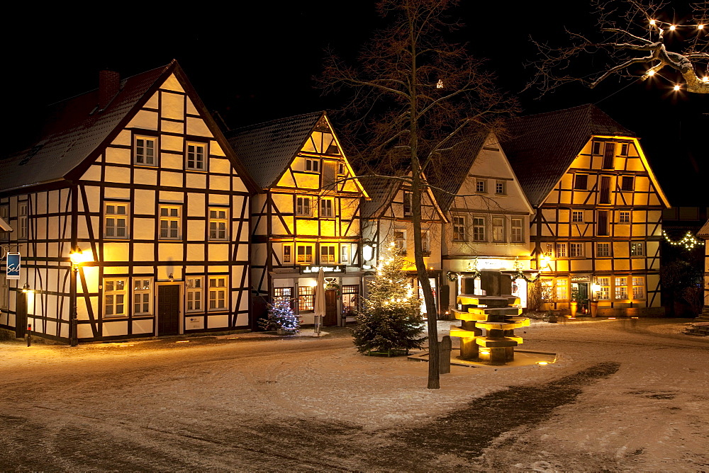 Half-timbered houses in the historic town centre with a Christmas tree and snow, Soest, Sauerland, North Rhine-Westphalia, Germany, Europe