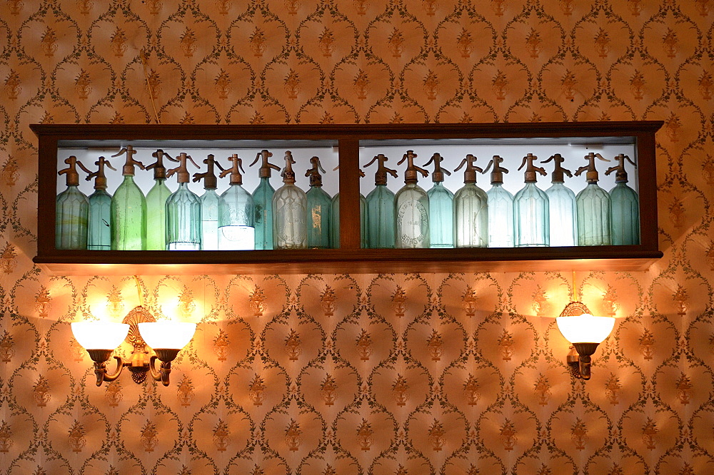 Soda syphon bottles used as a wall decoration in a cake store, Brasov, Romania, Europe