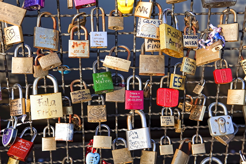 Love padlocks on the railing of Hohenzollernbruecke bridge, Cologne, North Rhine-Westphalia, Germany, Europe