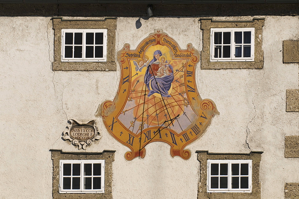 Mary and Christ child, sundial with a prayer, Steh uns bei in aller Not hier im Leben und im Tod, German for standing with us in every need here in life and in death, Salzburg, Austria, Europe