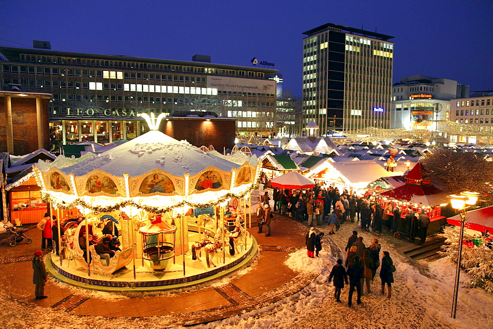 Christmas market on Kennedyplatz square at dusk, town centre of Essen, North Rhine-Westphalia, Germany, Europe